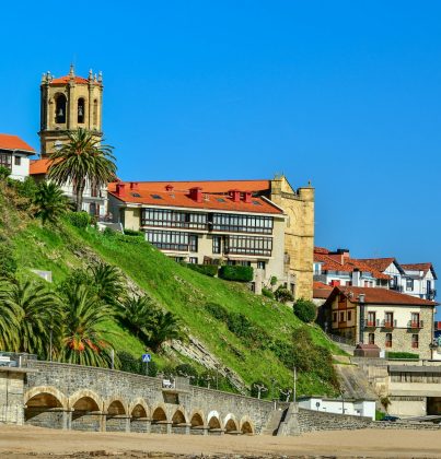 Idyllic townscape of Getaria, Spain with historic architecture on a sunny day.